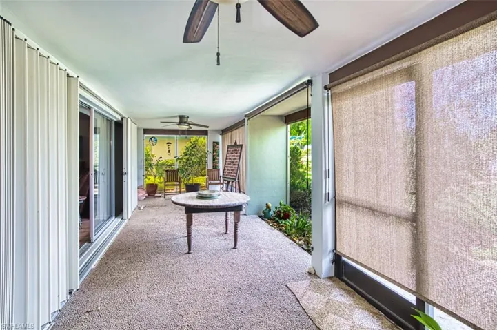 Sunroom with a ceiling fan and plenty of natural light