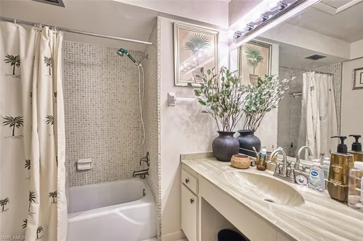 Full bathroom featuring vanity and shower / tub combo