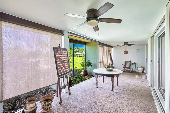 Sunroom / solarium with a ceiling fan