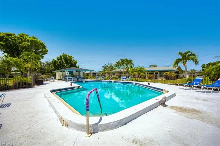 Community pool featuring a patio