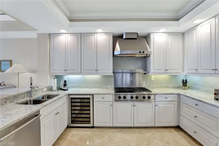 Kitchen with lots of cabinetry and tray ceiling