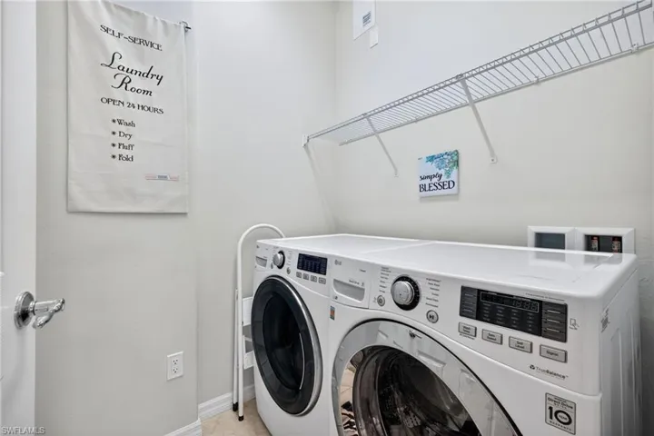 Large laundry room with storage space.