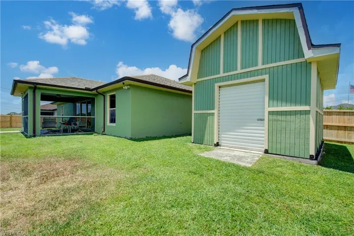 This shed/workshop/storage barn provides something extra that most properties do not have