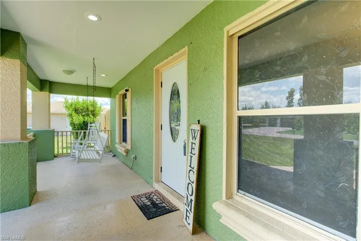 This enormous 26' x 7' covered front patio is a great place to sit & relax