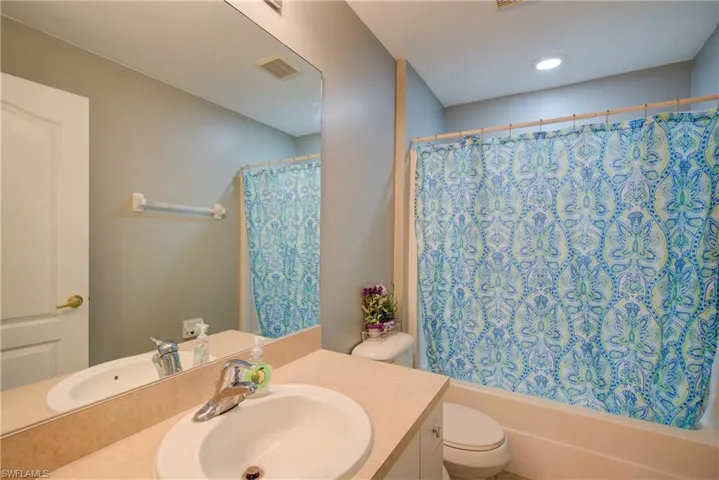 The guest bathroom with a tub/shower combo