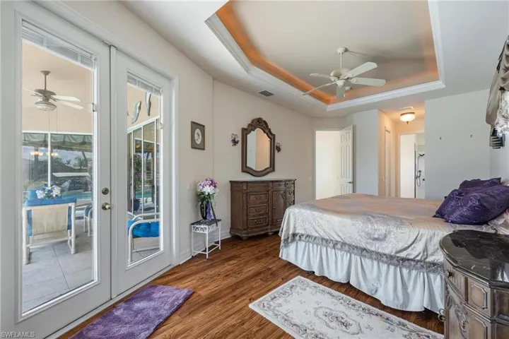 Stunning views from your French doors in the Master with tray ceiling and custom lighting