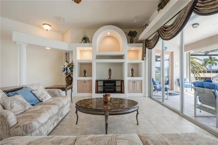 Living room with built ins and custom lighting