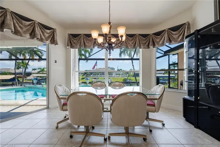 Dining Area with View of the Pool and Canal