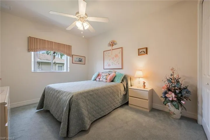 Guest Bedroom #1 with carpet and a window to bring in that natural light!