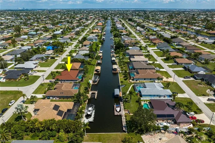 Arial view showing your home to the left and canal length.