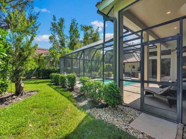 View of yard featuring a lanai and a patio area