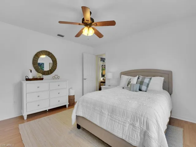 Bedroom featuring light hardwood / wood-style flooring and ceiling fan