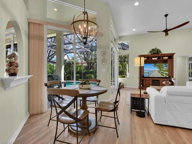 Dining space featuring light hardwood / wood-style flooring and a notable chandelier