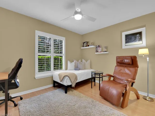 Bedroom featuring ceiling fan and light wood-type flooring