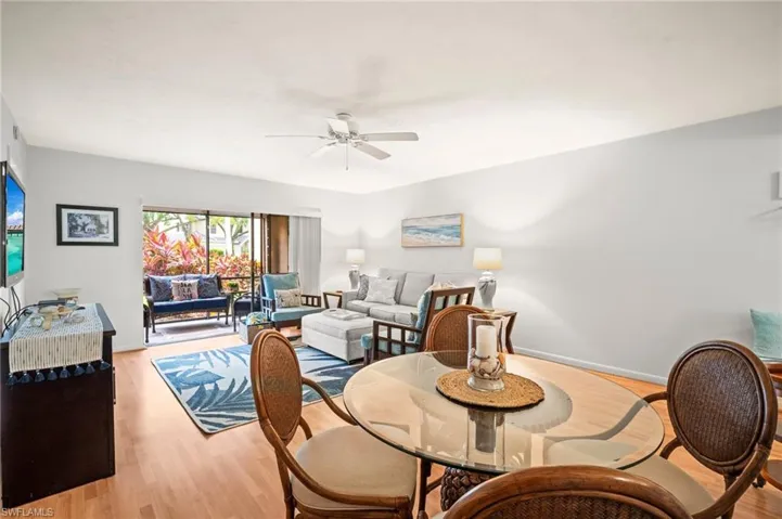 Dining room featuring ceiling fan and light wood finished floors