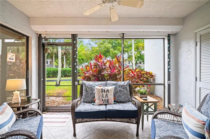 Sunroom / solarium with ceiling fan and an outdoor hangout area