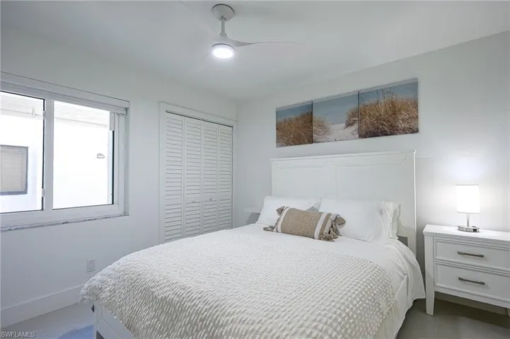 2nd bedroom queen bedroom with a closet and a ceiling fan