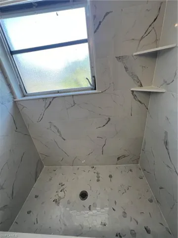 Bathroom with tiled shower