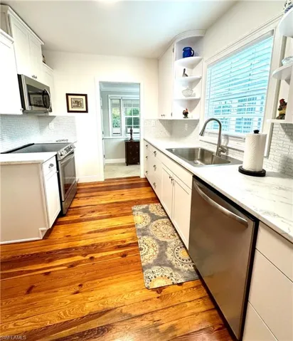 Kitchen with white cabinetry