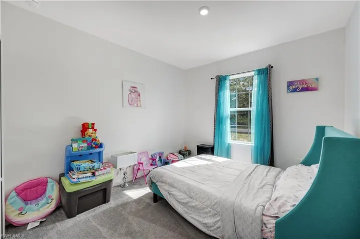 Bedroom featuring carpet flooring
