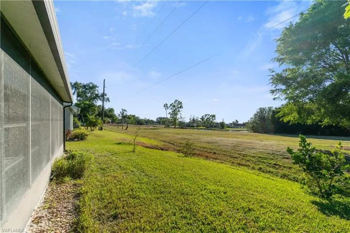View of yard featuring wide open 180 degree views of green space looking westerly.