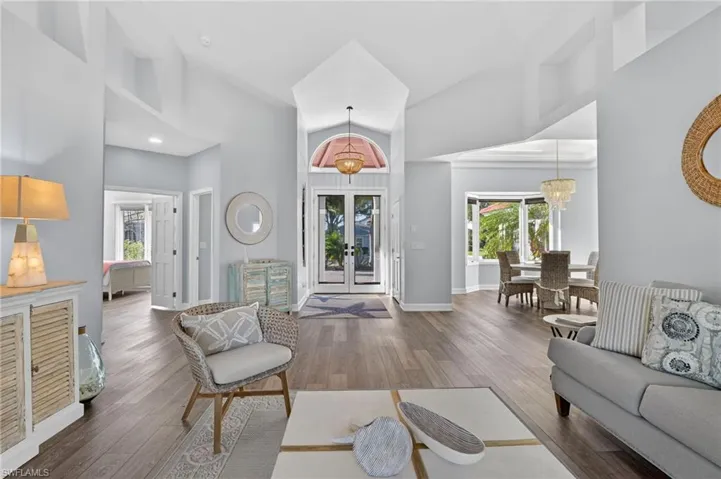 Another view of the living room showing the dining room on the right