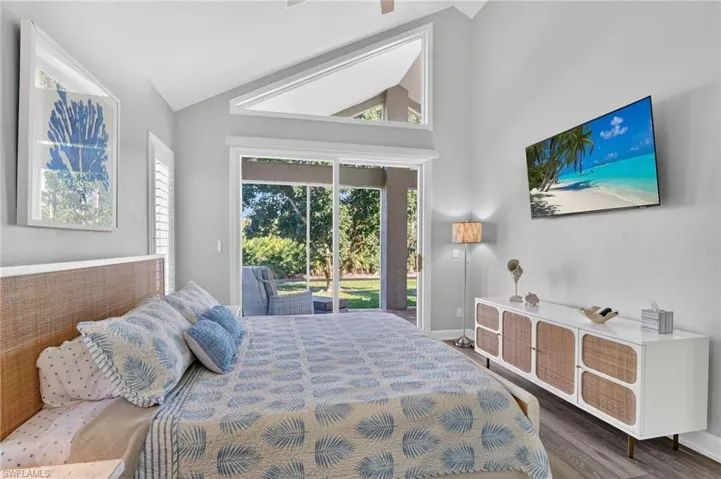 Bedroom 4 has extra windows above the slider to let in the Florida sunshine