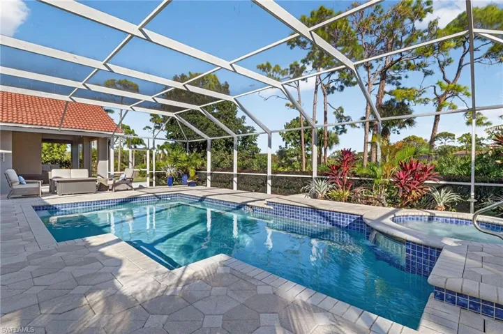 Enjoy your pool and nature from the oversized, screened lanai