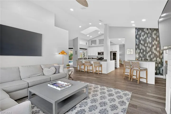 A view from the family room into the kitchen and wet bar