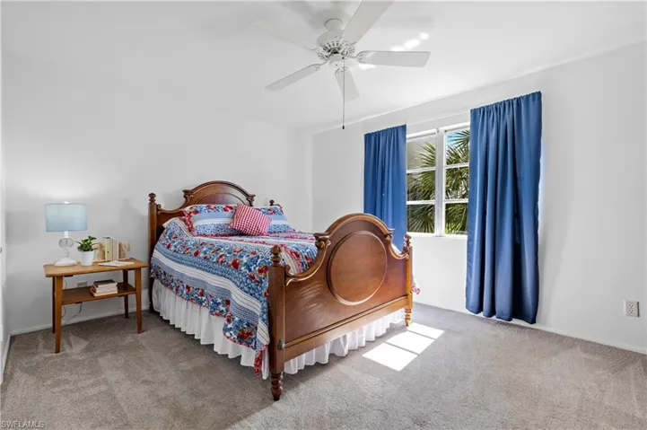 Bedroom with carpet flooring and a ceiling fan