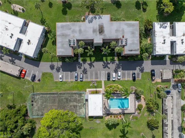 Aerial view of property and surrounding area with a pool area