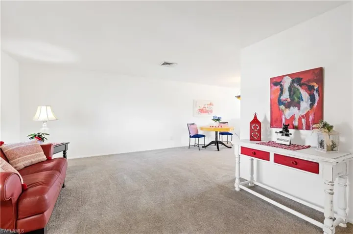 Game room with carpet flooring