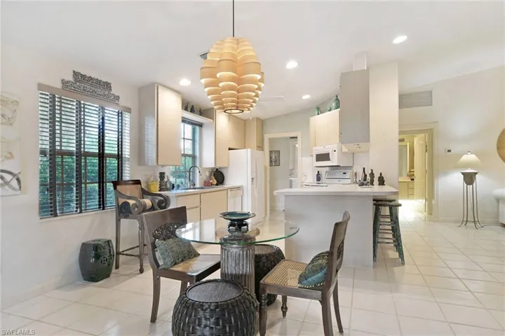 Tiled dining room with sink