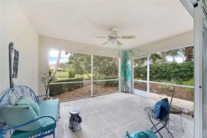 Sunroom / solarium featuring ceiling fan