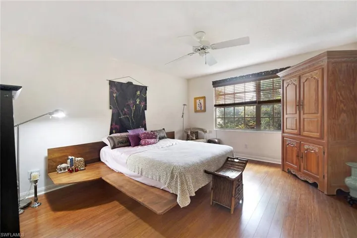 Master Bedroom with ceiling fan and wood-type flooring