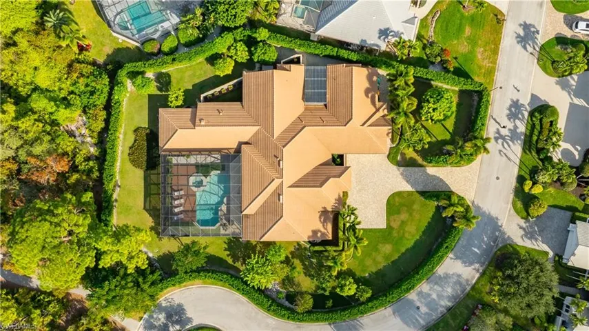Aerial view of property and 10 foot tall clusia privacy hedge