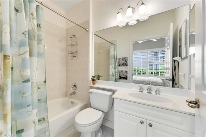 Guest en-suite bathroom with tub.