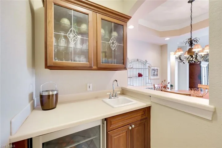 What is your pleasure? Just bring your favorited bottles of wine since your wet-bar is well equipped with sink, counters, beverage cooler, cabinets filled with wine glasses, etc., and a pass-through for serving family and guests.