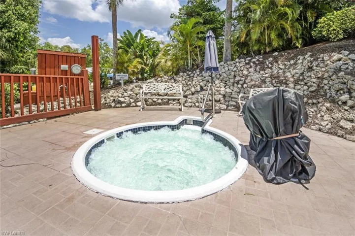 View of pool featuring an in ground hot tub and a patio
