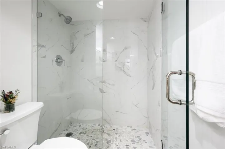 Bathroom with toilet and an enclosed shower