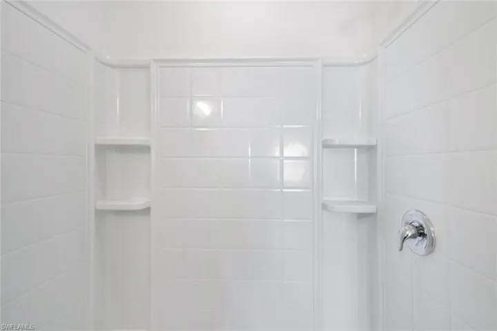 Interior details featuring tiled shower