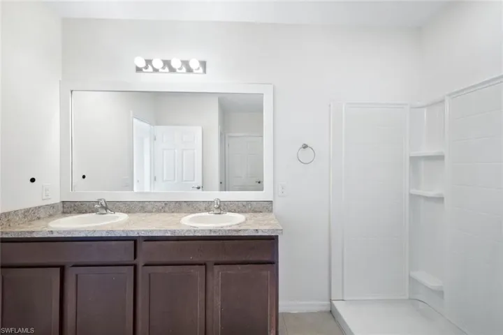 Bathroom with walk in shower and vanity