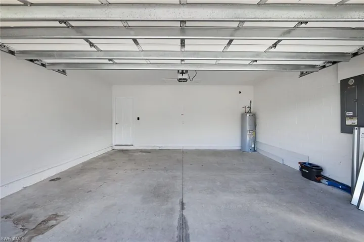 Garage with a garage door opener and water heater