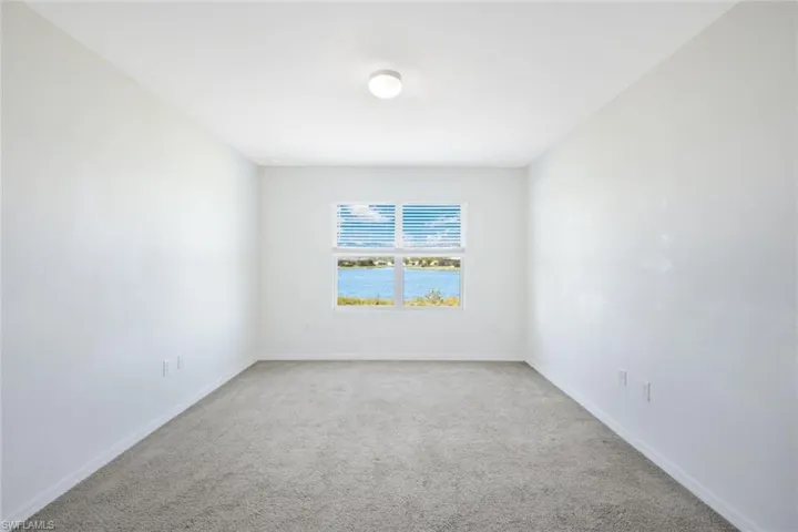 Spare room featuring carpet