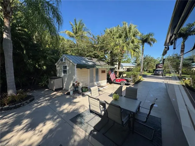 View of patio with an outbuilding