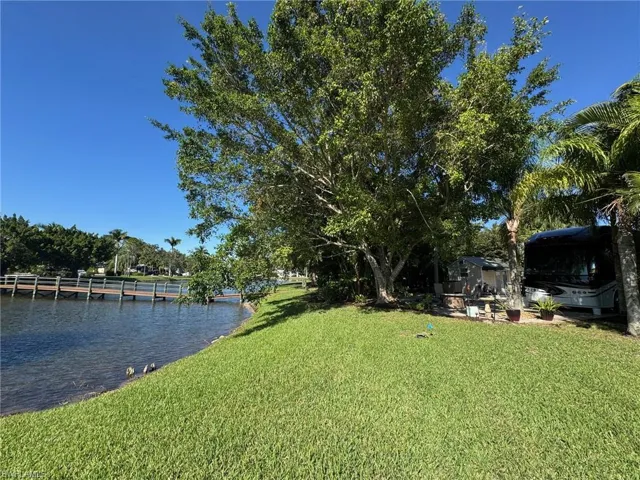 View of yard with a water view