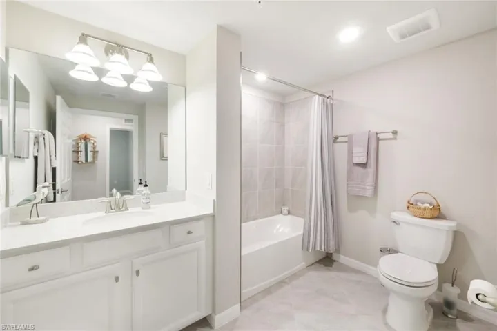 Full bathroom with bath/shower combination.
