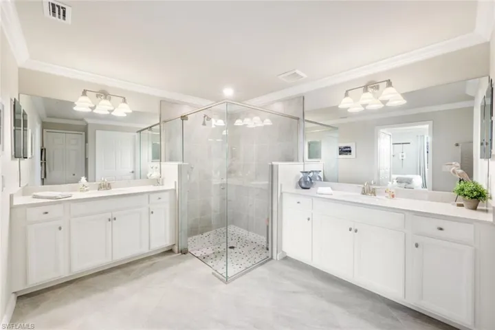 Primary Bathroom with large shower and split sinks.