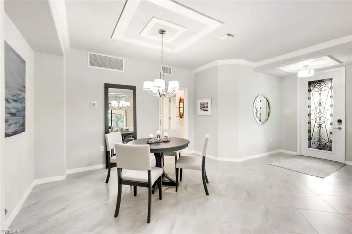 Dining area with decorative ceiling
