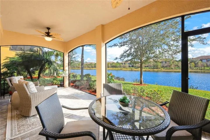 Large tiled lanai with with two ceiling fans and beautiful view.